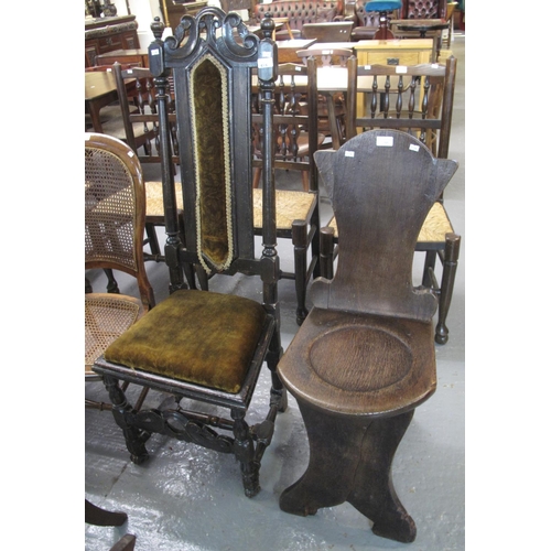 515 - 17th century style oak carved high back chair, together with an oak hall chair having shaped back mo... 