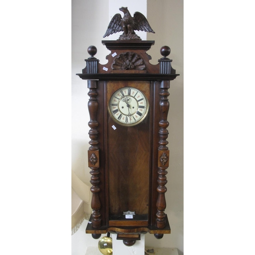 524 - Early 20th century walnut two train Vienna type wall clock with pendulum, key and two weights, havin... 