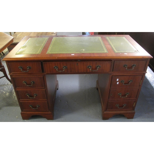 525 - Reproduction mahogany finish knee hole desk with leather inset top.  (B.P. 21% + VAT)