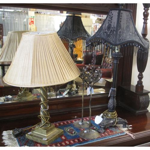 532 - Two modern table lamps, one in bronze finish standing on paw feet, together with a pair of modern br... 