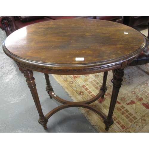 536 - Edwardian mahogany occasional table of oval form standing on tapering fluted legs.  (B.P. 21% + VAT)