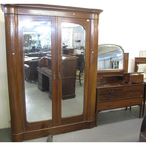 550 - Edwardian mahogany ornately inlaid two piece bedroom suit, to include: large mirrored double door wa... 