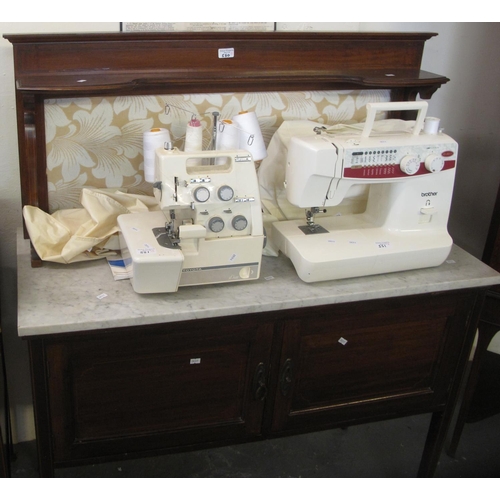 551 - Toyota SL3400 and Brother XL-5011 electric sewing machines with fitted hoods, together with an oak w... 