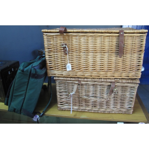 555 - Two modern wicker picnic hampers, together with another.  (3)  (B.P. 21% + VAT)