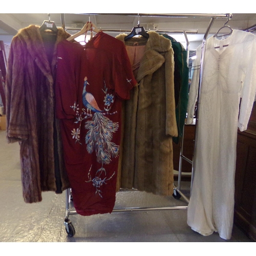 572 - Collection of vintage clothing to include: light brown 3/4 length fur coat, a similar faux fur coat ... 