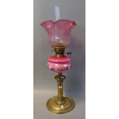 72 - Early 20th Century double oil burner lamp base,  having frosted etched foliate cranberry shade, pink... 