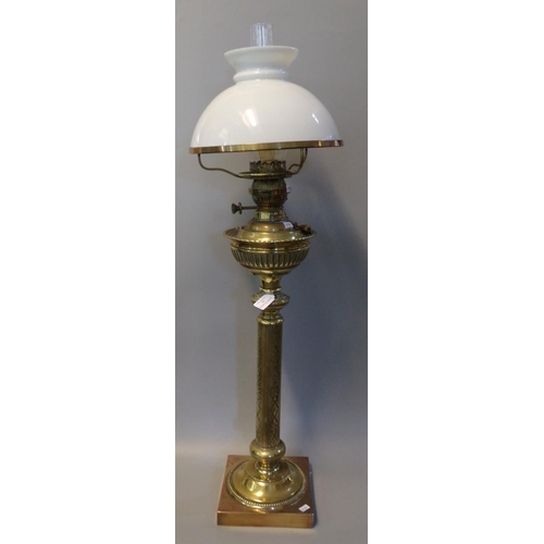 73 - Early 20th Century brass double oil burner lamp, having opaline glass mushroom shade, fluted reservo... 