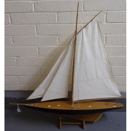 76 - Large wooden (probably beech) study of a single mast yacht on base. 
(B.P. 21% + VAT)