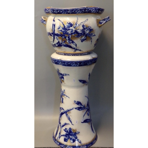 86 - Art Nouveau design German pottery jardiniere on stand, on a blue and white ground decorated with flo... 