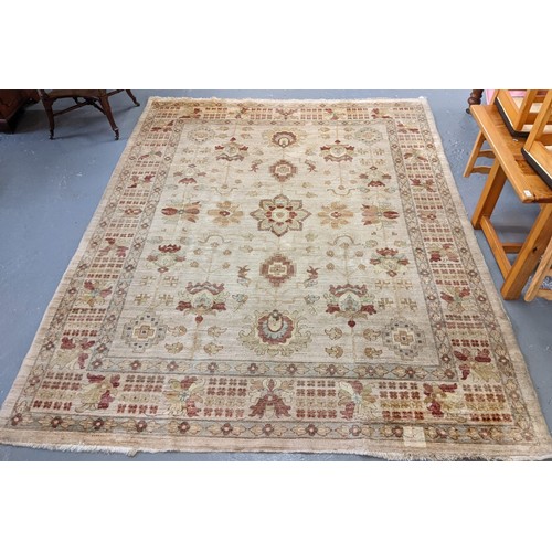 565 - Large cream ground multi coloured floral and foliate carpet.  319x249cm approx.  (B.P. 21% + VAT)