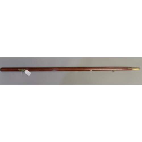 114 - Mahogany and brass pacing stick.  (B.P. 21% + VAT)