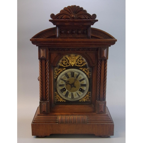 115 - Early 20th century walnut two train architectural design mantle clock.  (B.P. 21% + VAT)