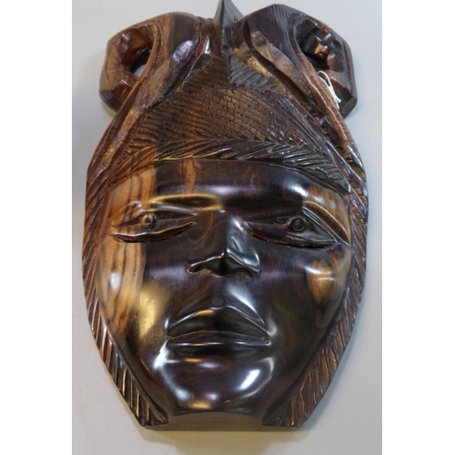 121 - Carved hardwood tribal bust of a male together with another  tribal carved hardwood mask.  (2)  (B.P... 