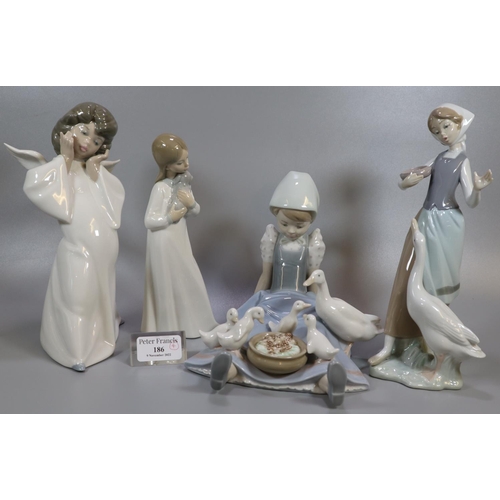 186 - Three Lladro porcelain figurines, to include: angel and girls with geese together with a Spanish fig... 