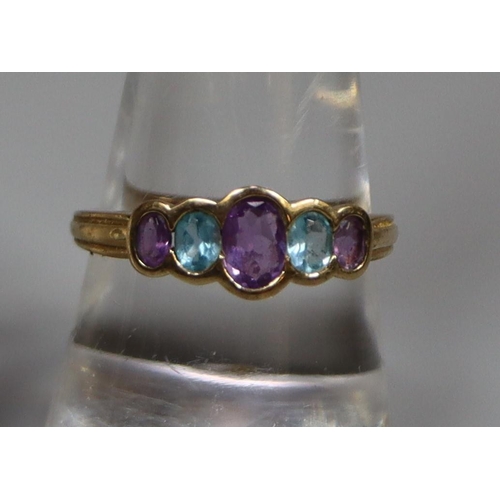 243 - 9ct gold five stone dress ring, set with amethyst and aquamarine stones.  Ring size Q.  (B.P. 21% + ... 