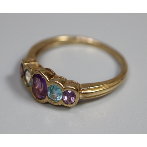 243 - 9ct gold five stone dress ring, set with amethyst and aquamarine stones.  Ring size Q.  (B.P. 21% + ... 