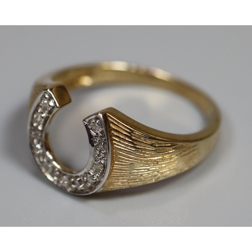 247 - 9ct gold diamond set horseshoe design dress ring.  3.2g approx.  Ring size R.  (B.P. 21% + VAT)