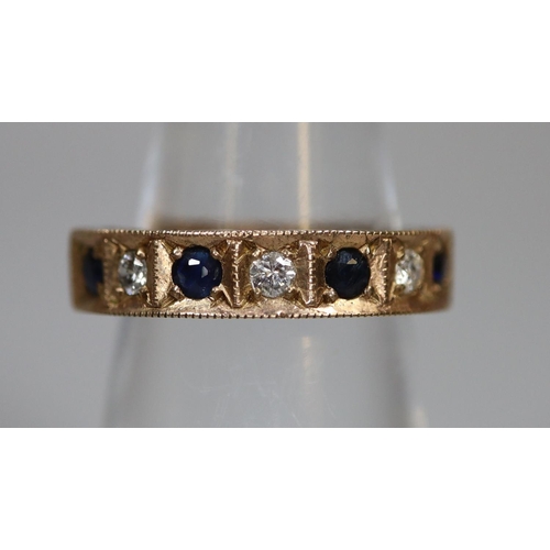 249 - 9ct gold sapphire and diamond half hoop eternity ring with engraved decoration.  3.5g approx.  Ring ... 