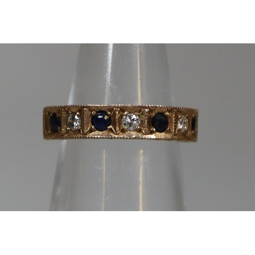 249 - 9ct gold sapphire and diamond half hoop eternity ring with engraved decoration.  3.5g approx.  Ring ... 