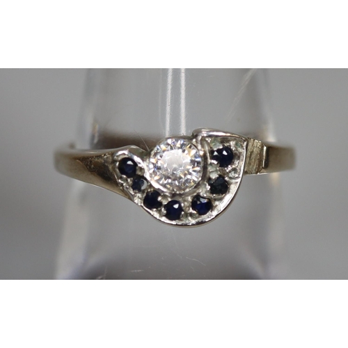 250 - 9ct white gold 'D' shaped diamond and sapphire dress ring.  2.2g approx.  Ring size N.  (B.P. 21% + ... 