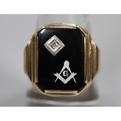 255 - 9ct gold Masonic signet ring, set with black stone having single small diamond.  5.2g approx.  Ring ... 