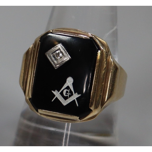 255 - 9ct gold Masonic signet ring, set with black stone having single small diamond.  5.2g approx.  Ring ... 