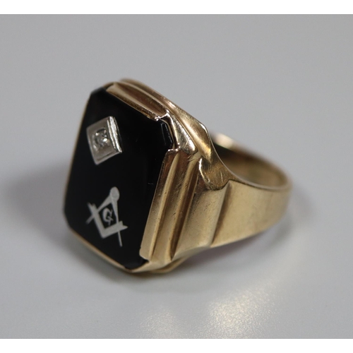 255 - 9ct gold Masonic signet ring, set with black stone having single small diamond.  5.2g approx.  Ring ... 