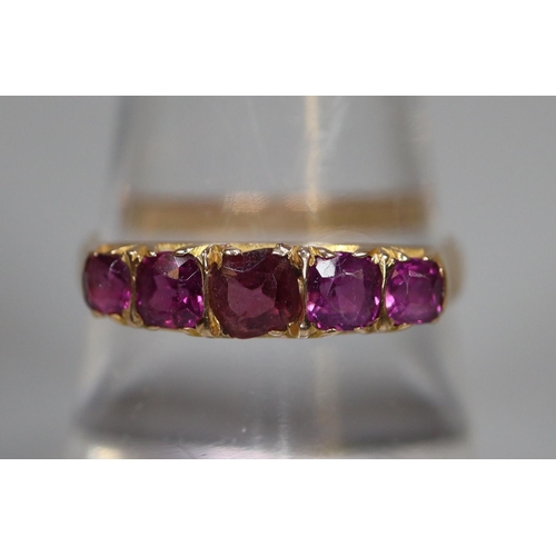 259 - 15ct gold five stone amethyst dress ring.  2.2g approx.  Ring size O.  (B.P. 21% + VAT)