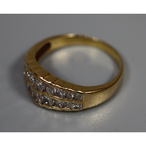 261 - 18ct gold diamond double row eternity ring.  3.6g approx.  Ring size M.  (B.P. 21% + VAT)