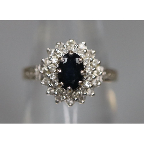 263 - 9ct gold dress ring set with sapphire and diamond chips.  2.5g approx.  Ring size Q.  (B.P. 21% + VA... 