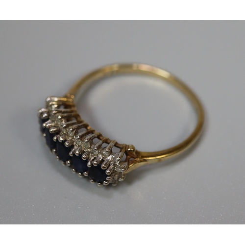 264 - 9ct gold dress ring set with five sapphires and diamond chips.  2.5g approx.  Ring size R.  (B.P. 21... 