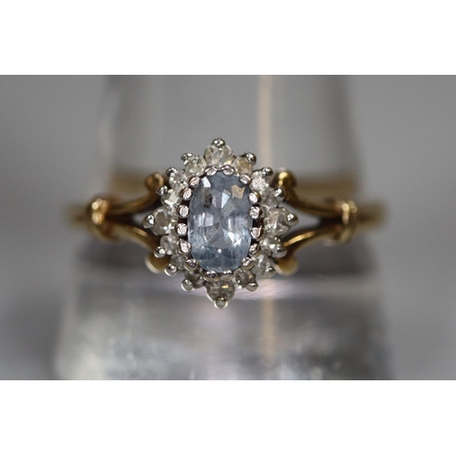 267 - 9ct gold aquamarine and diamond split shank dress ring.  2.6g approx.  Ring size T.  (B.P. 21% + VAT... 