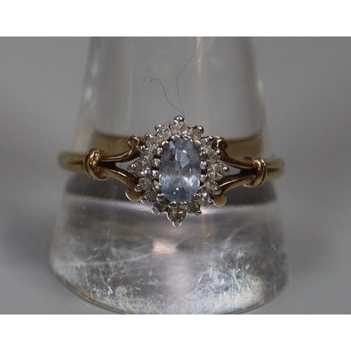 267 - 9ct gold aquamarine and diamond split shank dress ring.  2.6g approx.  Ring size T.  (B.P. 21% + VAT... 