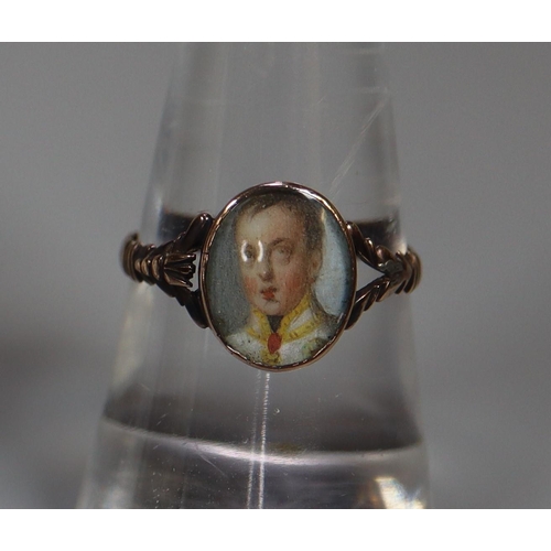 271 - 19th century Georgian style gold signet ring set with miniature portrait panel of a young gentleman.... 