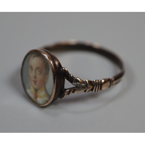 271 - 19th century Georgian style gold signet ring set with miniature portrait panel of a young gentleman.... 