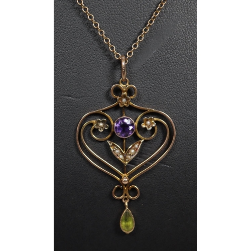 277 - Pretty Art Nouveau design 9ct gold heart shaped pendant set with stones and seed pearls on fine link... 