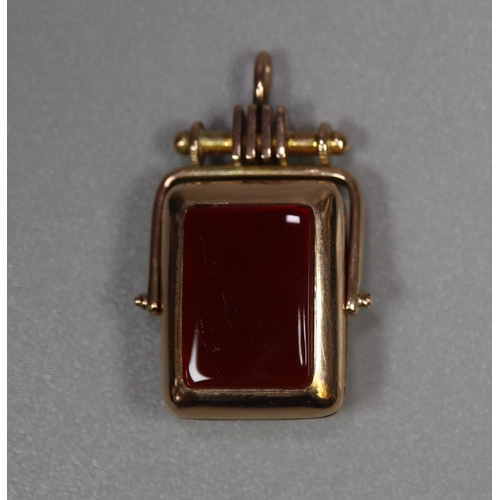 284 - Gold stone set initial 'M' spinning fob, hinged as a locket.  7g approx.  (B.P. 21% + VAT)