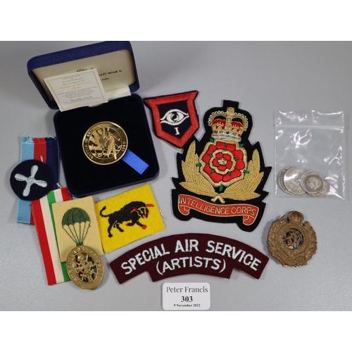 303 - Plastic box of GB silver coins and military items, to include: boxed medallions, uniform patches, ca... 