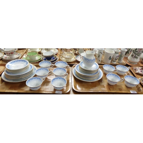 342 - Two trays of continental blue, white and gilt teaware including: teacups, saucers, plates, milk jug ... 