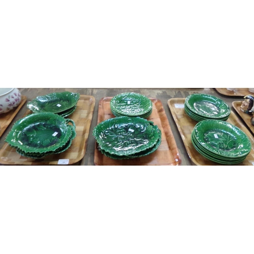 399 - Three trays of Wedgwood (unstamped) and other Majolica dark green cabbage ware pottery: ten cabbage ... 