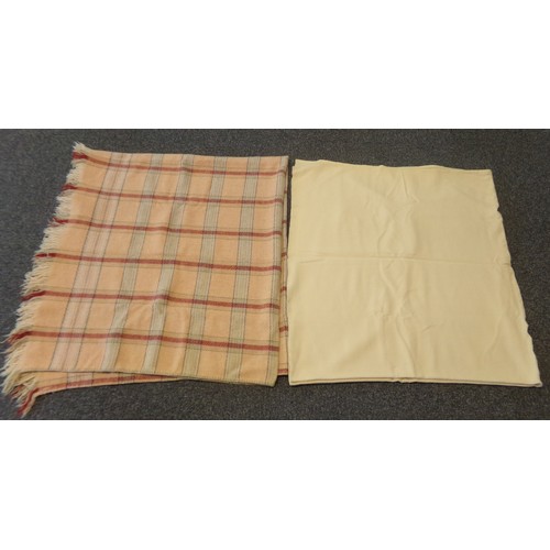 358 - Two vintage Welsh woollen blankets: one plain cream and the other a peach ground check blanket or ca... 