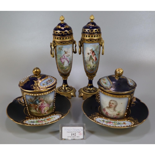 192 - Pair of early 20th Century Sevres porcelain hot chocolate cups, covers and saucers, on a cobalt blue... 