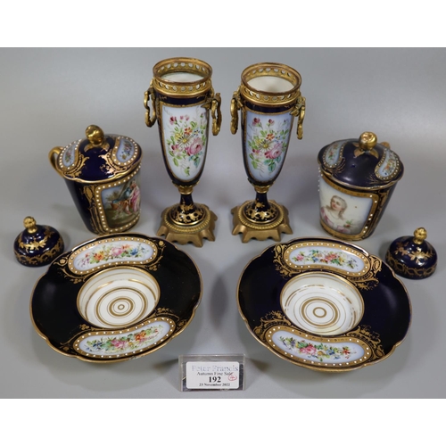 192 - Pair of early 20th Century Sevres porcelain hot chocolate cups, covers and saucers, on a cobalt blue... 