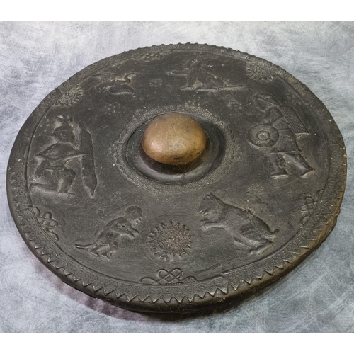 226 - Cast bronze South East Asian gong decorated with human figures, animals and a bird inside spearhead ... 