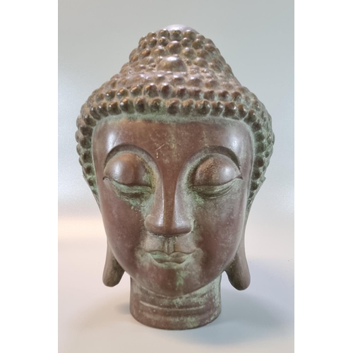 228 - A Thai or Siamese style cast bronze Buddha head.  Probably 19th or 20th century.  27cm high approx. ... 