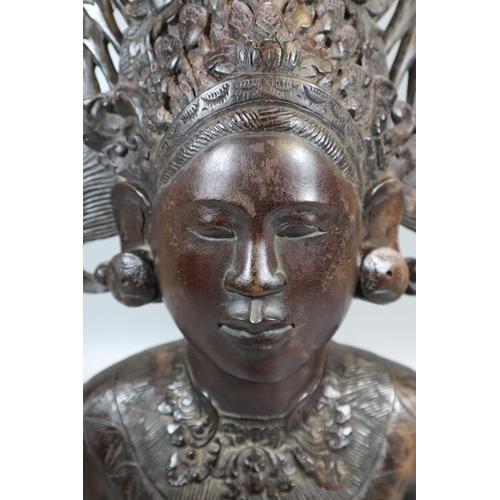 229 - Carved hardwood Balinese bust of a woman in unusual headdress.  Probably 20th century.  53cm high ap... 