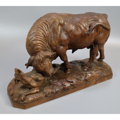 231 - Johann Huggler (1834-1912), a Black Forest carved probably walnut figure group of a bull goring a ho... 