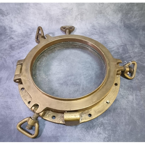 259 - Large heavy brass ship's porthole with frame and locking screws.  Overall 43cm diameter approx.   (B... 