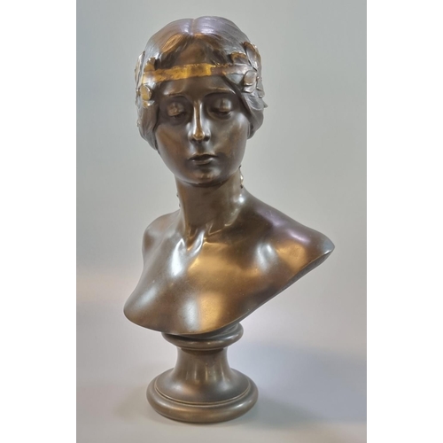 260 - Ferdinand Barbedienne (French 1810-1892), a patinated Art Nouveau bronze bust of a young woman with ... 