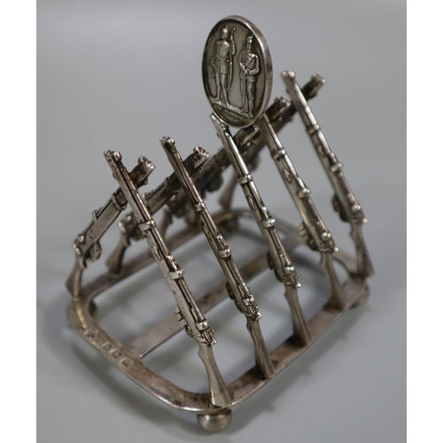 265 - Silver shooting trophy four division toast rack, the divisions in the form of Lee Enfield rifles, ha... 